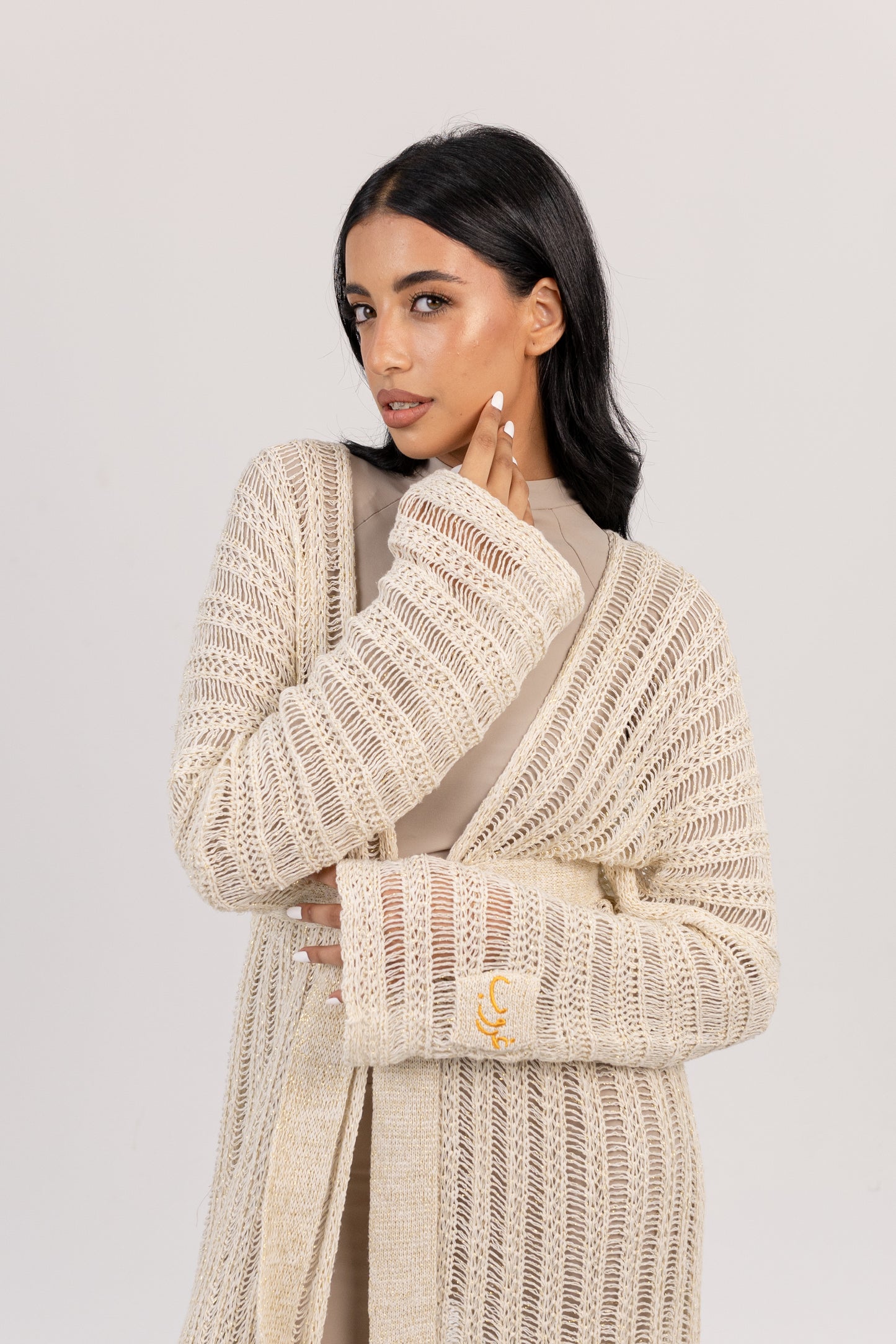 Ghoroub Coverup in Off-white with Gold, close portrait view