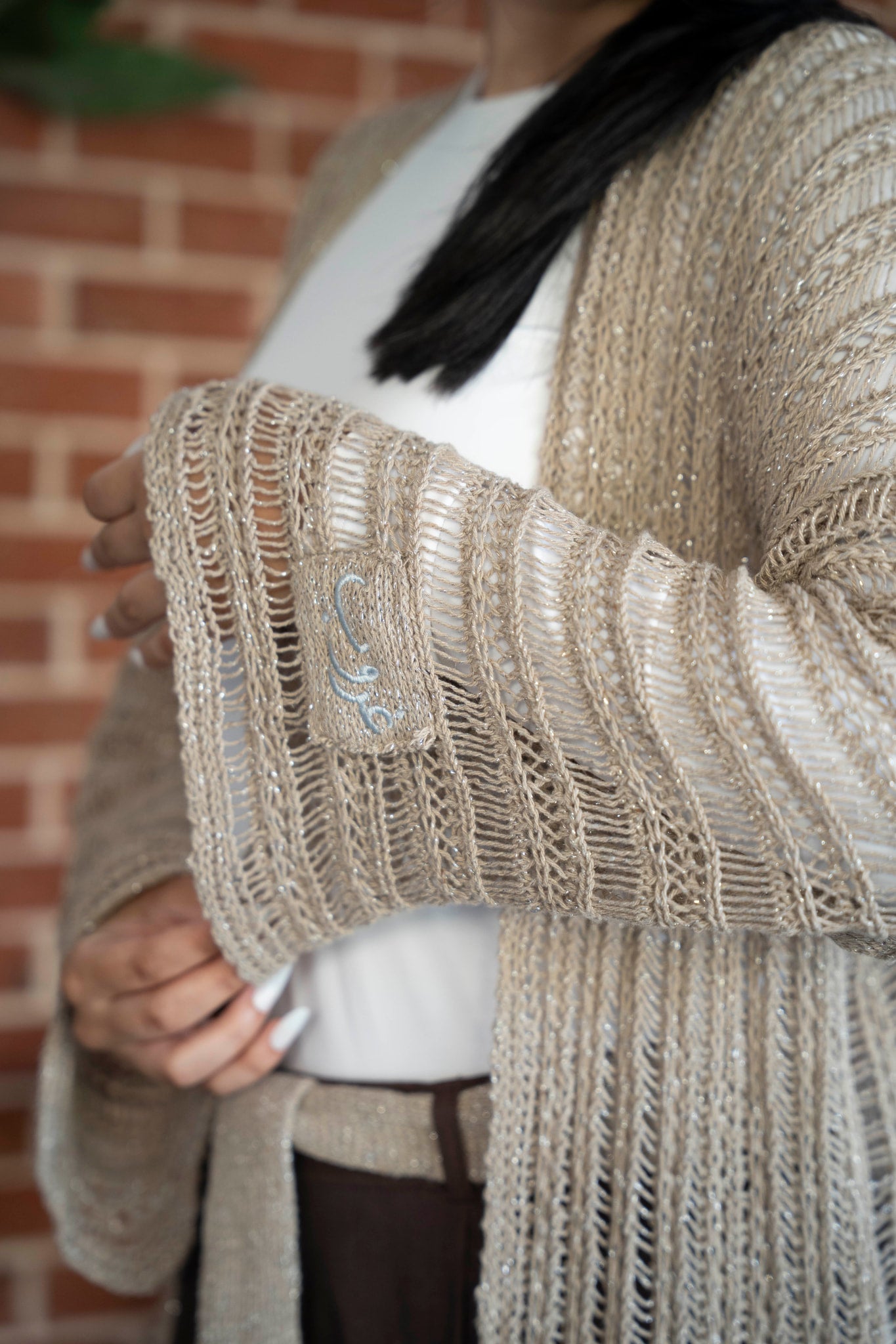 Ghoroub Cardigan in Dusk Beige · Silver, close-up of the embroidered cuff detail.