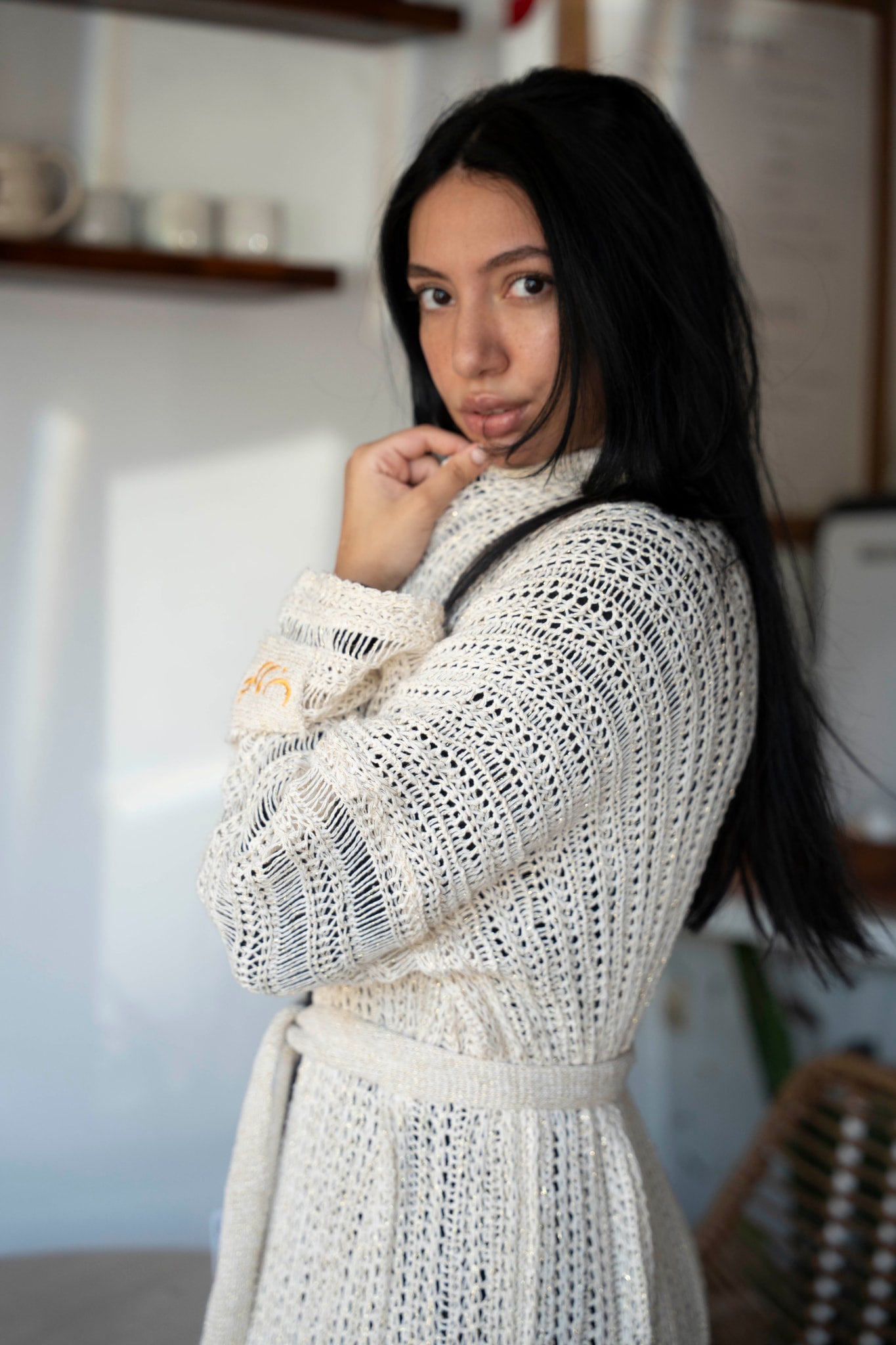 Ghoroub Cardigan in Sunset Ivory · Gold, close portrait showing the open-knit texture.